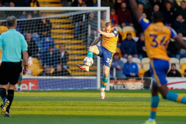 Mansfield Town's John-Joe O'Toole stays strong in defence on Tuesday.