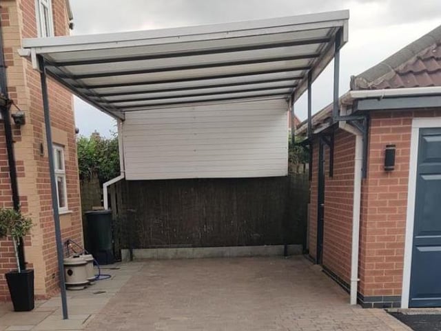 The front of the house does not only feature a sizeable driveway and impressive double garage (as you can see from the main picture with this article) but also this car port.