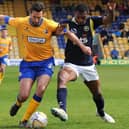 Ollie Palmer in Mansfield Town action challenging another ex-Stag, Krystian Pearce of Torquay United, in 2014.
