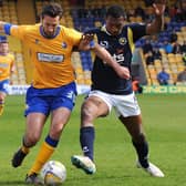 Ollie Palmer in Mansfield Town action challenging another ex-Stag, Krystian Pearce of Torquay United, in 2014.