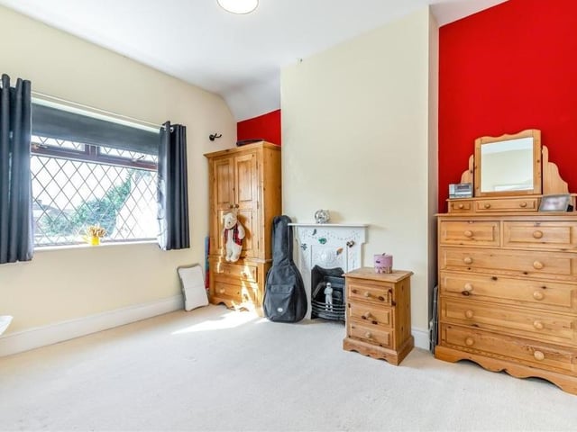Here is bedroom number three, which also has an original cast-iron feature fireplace. It overlooks the front of the house.