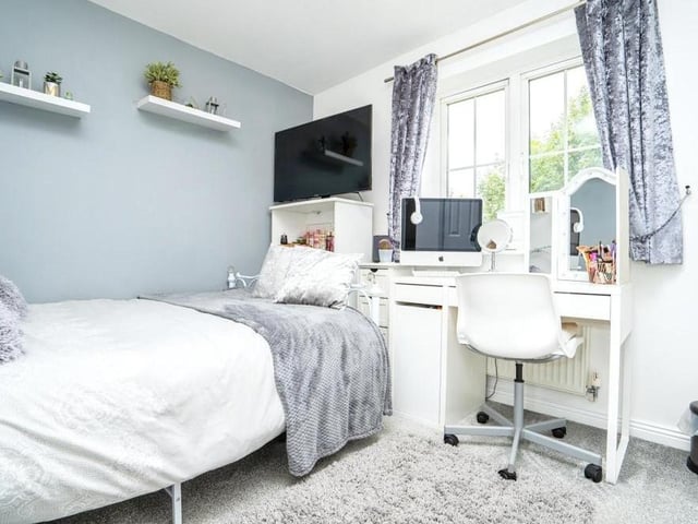 Another pleasant bedroom which, like the other three, is generously sized. There is room for a dressing table, and the floor is carpeted.