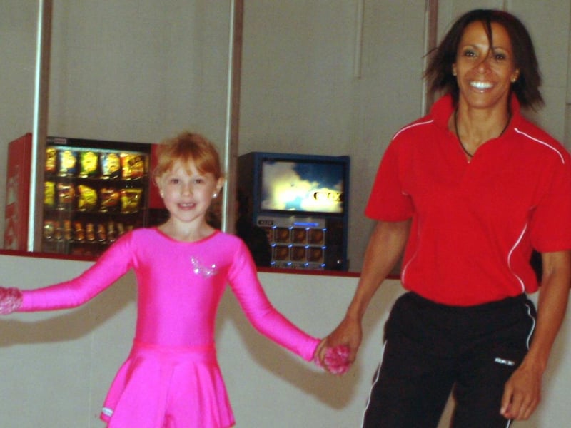 Dame Kelly Holmes ice skating with Molly Stone, then aged 6.