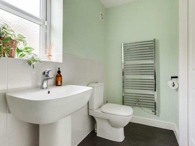 A chrome, heated towel-rail and low-level dual-flush WC can also be found in the en suite shower room to the master bedroom. Recessed spotlights, partially tiled walls and vinyl flooring complete the package.