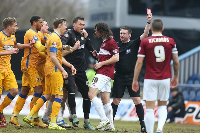 John-Joe O'Toole of Northampton Town is shown a red card by referee Lee Collins in a 2015 game that finished 1-1.