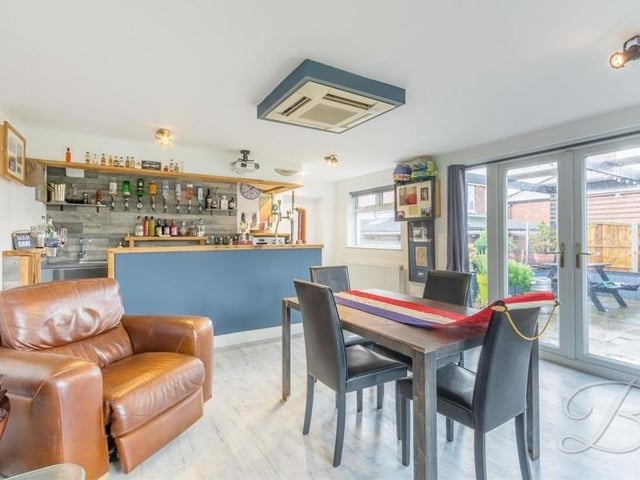 Next door to the dining room and sitting room is this fantastic bar. This will certainly become a favourite spot for evening drinks, especially in the summer when it opens out into the garden.