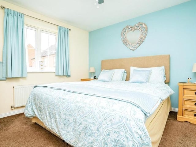 The master bedroom at the Pippin Close property is warm and relaxing. Facing the front of the house, it boasts fitted wardrobes and a carpeted floor.