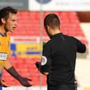 Mansfield Town's Will Atkinson is about to be sent off at Swindon Town in 2018.