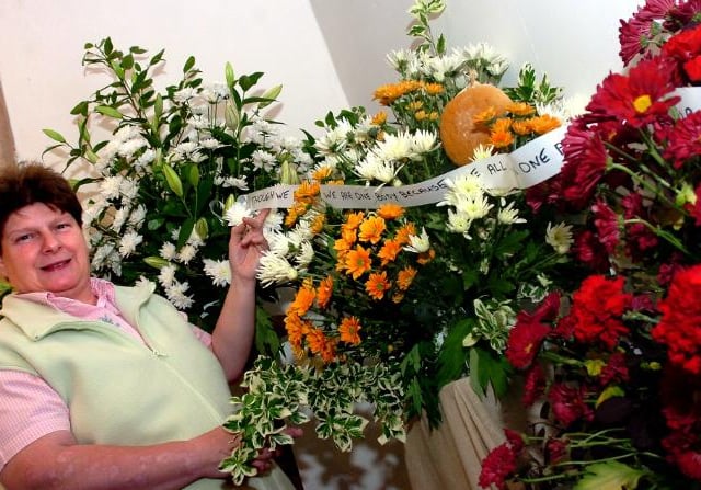 Loversall church turned 800 in 2006. Denise Murden with her flower arrangement.