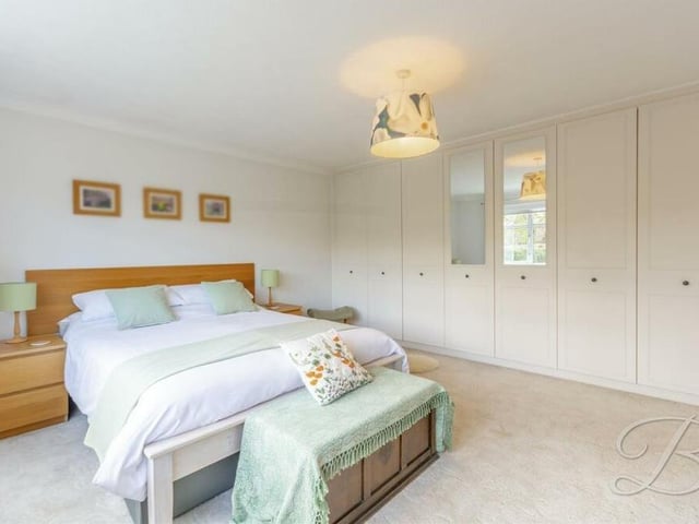 A second image of the second bedroom, which shows off its big fitted wardrobes