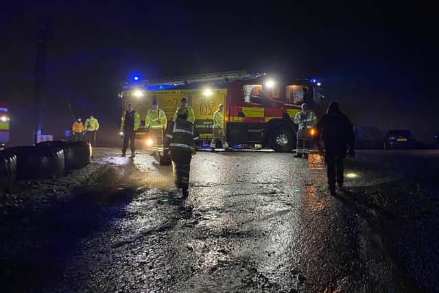 Police and firefighters at the scene of the rescue operation in Mansfield Woodhouse, where three teenagers had become stuck in freezing quicksand