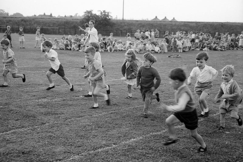 Youngsters enjoy a sprint race. One runner seems have lost his lane. This was taken in 1965 during a sports day at Newgate Lane.