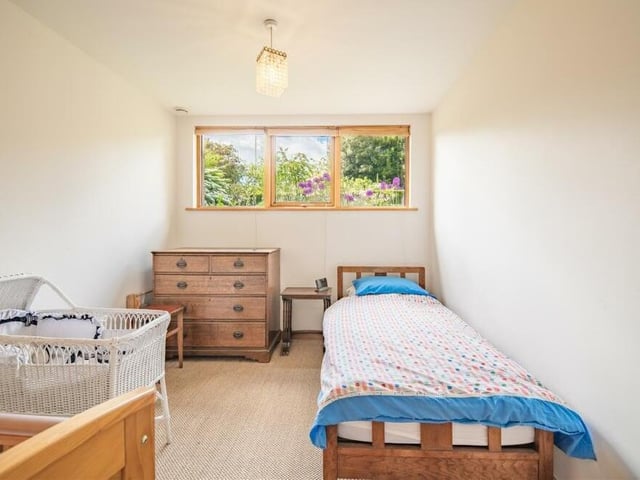 A cosy and compact single bedroom on floor one of The Garden House.