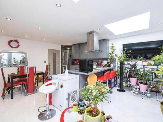 This shot of the open-plan kitchen/dining/living area underlines how much space there is available at the chalet-style bungalow.