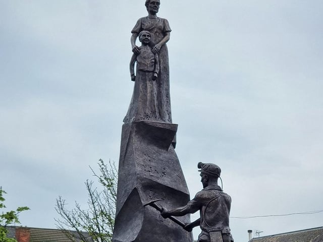 The statue is the work of sculptor, Peter Walker. It stands in the market place.