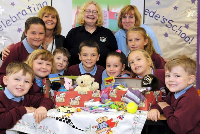 Pupils are pictured helping to launch the 2014 Operation Christmas Child shoebox appeal, with Carol Hall, centre, headteacher Moria Rooney, left, and Trish Octon. Does this bring back happy memories?