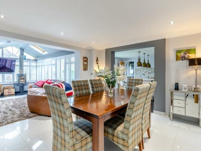 The dining room is a pleasant space for family meals or for entertaining friends. As you can see, it flows seamlessly into the garden room.
