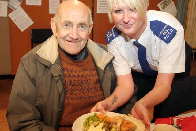 Police serving Christmas dinners at St.Augustines church in 2007   l to r  Harry Stevens and P C S O Amelia Anstey-Ainsworth
