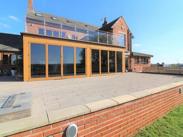 The raised garden terrace is paved and the ideal space for alfresco entertaining or relaxation.