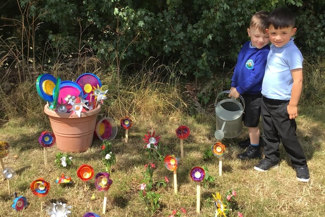 F1 used paint tin lids and plastic bottles to create a flower garden.