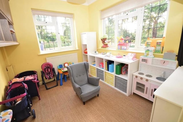 A further reception room, which is a useful addition to the ground floor, is this study or play area. Thoroughly versatile to suit your own needs, it is bright and light, with windows at the back and side.