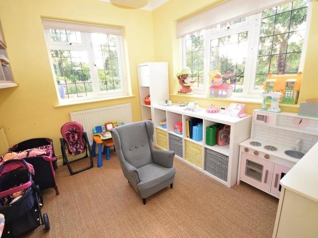 A further reception room, which is a useful addition to the ground floor, is this study or play area. Thoroughly versatile to suit your own needs, it is bright and light, with windows at the back and side.