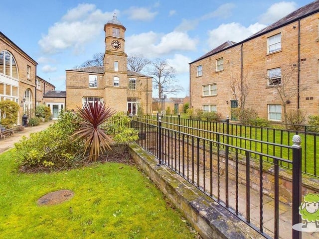 This is the attractive, quite striking view from the front of the Berry Hill Lane property, showing the clock tower of the historic hall.