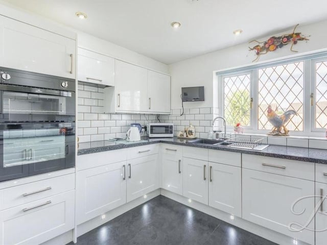 Even a master chef would love cooking family meals in this kitchen! It boasts an integrated double oven and hob with extractor fan above, and there is an abundance of space to utilise. Downlights and a large window to the back of the bungalow add to its appeal.
