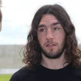 Sporting considerably more hair than now, Northampton Town new signing John-Joe O'Toole looks on during a photo call at Sixfields Stadium on June 30, 2014.