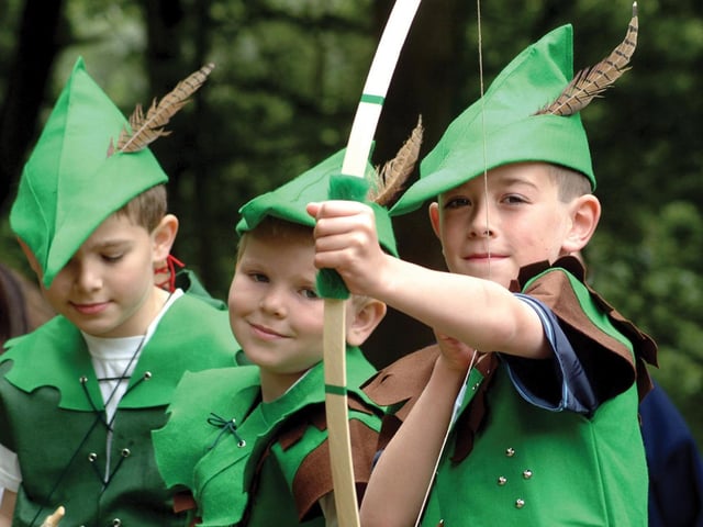 Wannabe Robin Hoods wait for Robin Hood to arrive at the Major Oak during the Robin Hood festival in 2005.