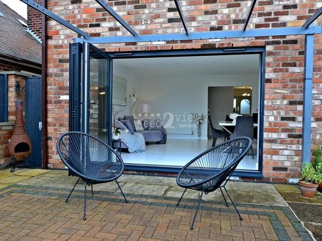 Pleasant patio areas are dotted around the back garden. Here is one directly outside the dining area.