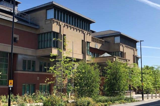 Sheffield Crown Court, pictured, heard how a "disgraceful" roofer has been jailed after he sexually molested a 73-year-old woman in her Sheffield home.