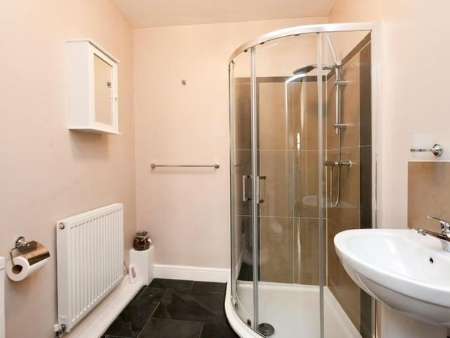 One of the double bedrooms sits on the ground floor of the property - and not far away is this handy shower room.