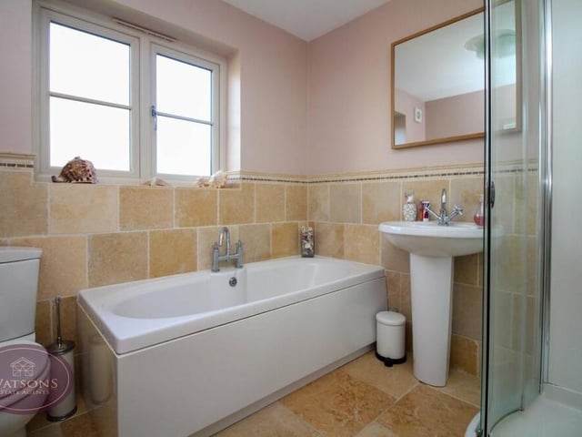 A four-piece suite in white makes up the family bathroom on the first floor. There is a bath, corner shower cubicle with rainfall, mains-fed shower, pedestal sink unit, WC, chrome, heated towel-rail and extractor fan.