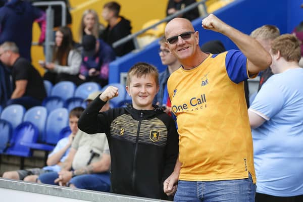 Mansfield Town fans watch the Stags beat Tranmere Rovers last season.