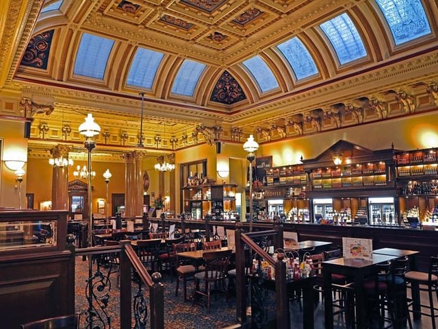 Pick up discounted food and soft drinks in this grand former bank building.