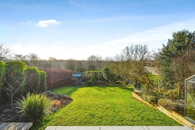 The gorgeous rear garden, which has been elegantly designed by the current owners of the Kirkby property, can be accessed from the kitchen diner, the living room or the garage. As well as the lawn, it includes a shed, a greenhouse and even a cabbage patch.