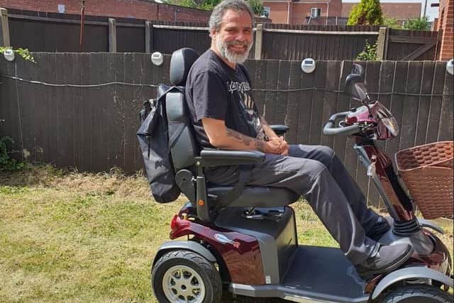 Jason Kennedy on his mobility scooter which has been stolen, leaving him unable to leave his flat