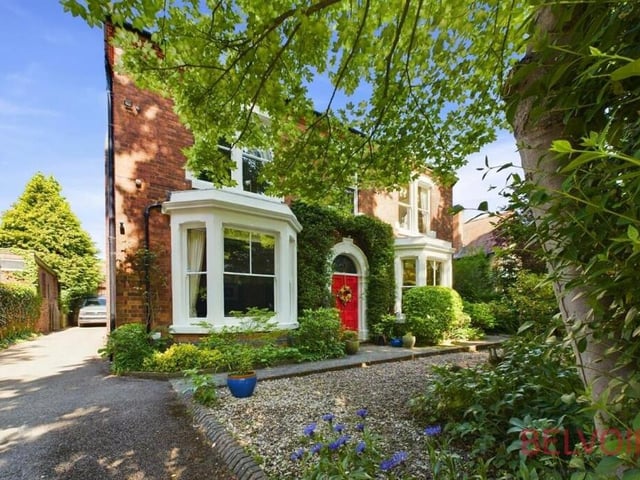 Back to the front, where the house is shielded from the road by a large hedge and mature trees and where electric, wrought-iron gates lead to a lengthy driveway at the side if the property, offering off-street parking space.