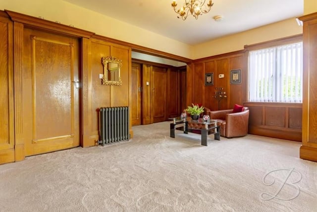 At the top of the staircase, you are greeted by this attractive landing, which leads to all four bedrooms and the family bathroom. It has solid oak panelling, two storage cupboards, a carpeted floor and a double-glazed window overlooking the front of the house.