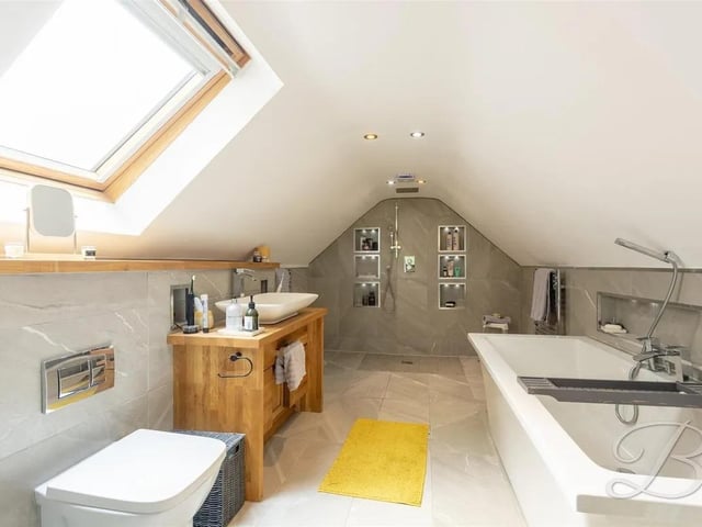 The perfect place to unwind after a busy day. The bathroom is fitted with a contemporary four-piece suite, comprising a shower, bath, low flush WC, and hand wash basin, offering both style and functionality.