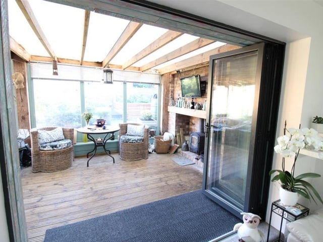 Bi-fold doors give direct access from the lounge to the garden room.