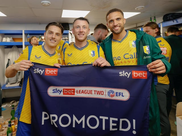 Mansfield Town's fans and players celebrated promotion to League One long into the night.