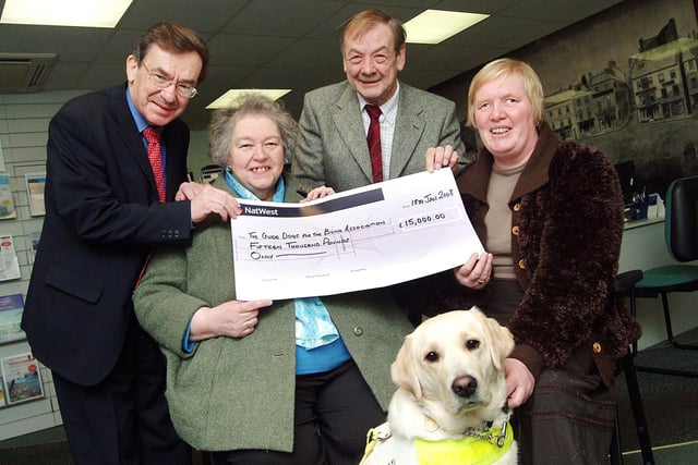 Chad's Editor in 2008, Jeremy Plews, left, hands over a £15,000 cheque to Mansfield Branch Chairman of the Guide Dogs for the Blind fund, Nancy Else, District Fundraiser Tony Pointer and guide dog user Kathleen Patten with her dog Vogue