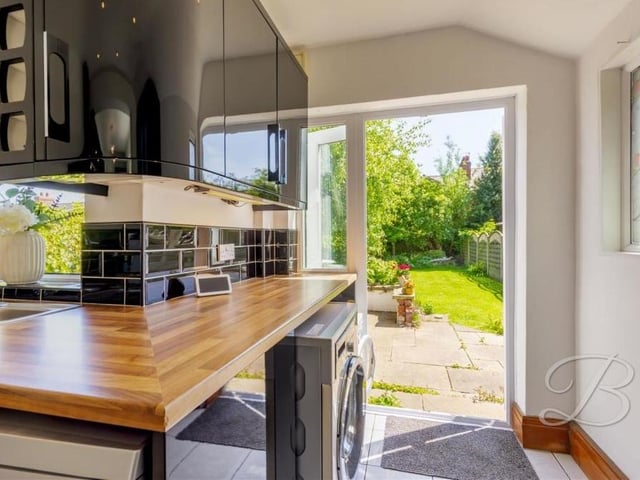 A pair of French doors give handy access from the kitchen to the back garden of the Layton Avenue property.