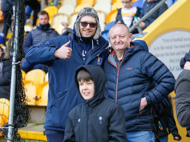 Mansfield Town fans watch the match against Northampton Town.