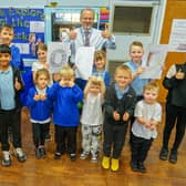 Thumbs up from head teacher Julian Fieldwick and children at Intake Farm Primary School in Mansfield as they celebrate a rating of 'Good' from education watchdog, Ofsted.