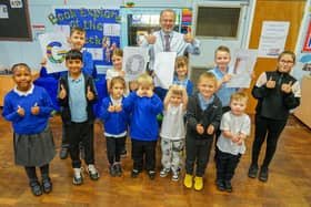 Thumbs up from head teacher Julian Fieldwick and children at Intake Farm Primary School in Mansfield as they celebrate a rating of 'Good' from education watchdog, Ofsted.