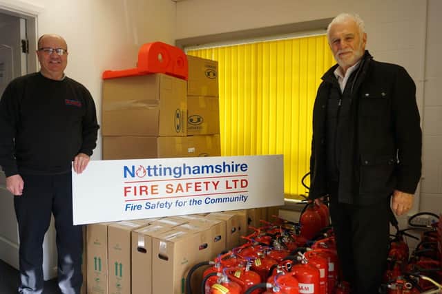 Pictured are Phil Kennell, of Nottinghamshire Fire Safety Ltd, with Councillor Andre Camilleri, Nottinghamshire County Council's Deputy Cabinet Member for Finance and Resource.