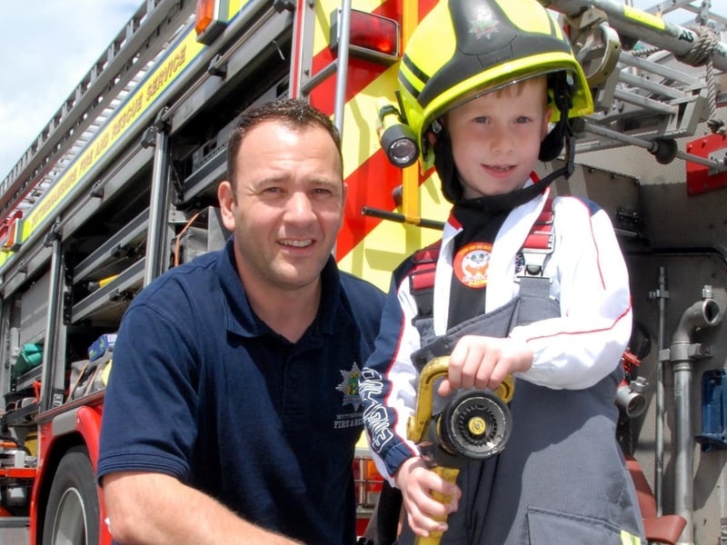 Sutton's St Mary Magdalene Primary School held a Summer Fair in 2010. Pupil Braydon Warren became a Fireman for the day. Braydon is pictured with Ashfield Red Watch, Fire Fighter Peter White.